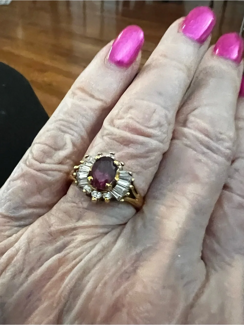 Gold Ring with Ruby-Red Center and Clear Accent Stones